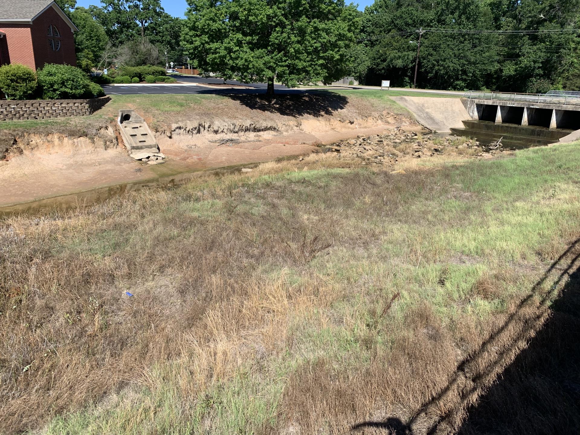 An image of the West Mud Creek channel near the Glenwood Church of Christ in Tyler, Texas.