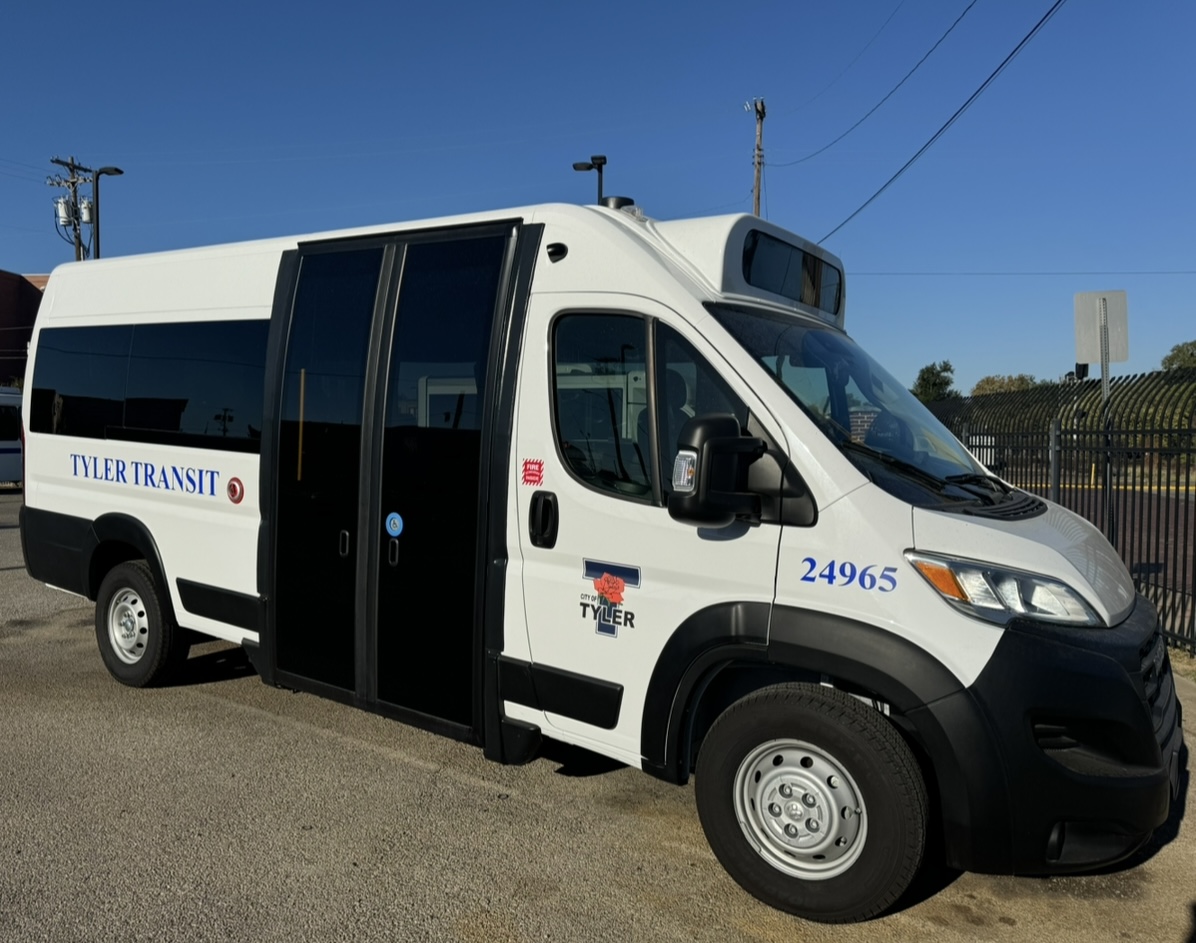 An image of a parked Tyler Transit eight-passenger bus.