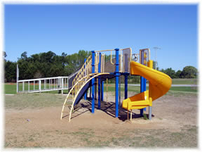Playground with twisty slide